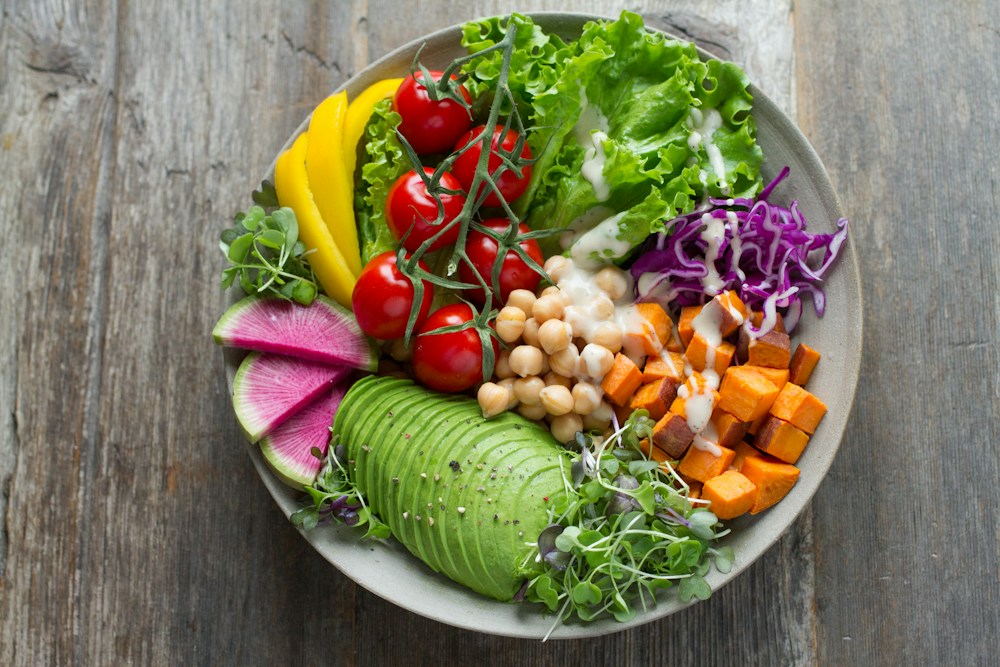 A colourful bowl of vegetables, grains and nourishing ingredients